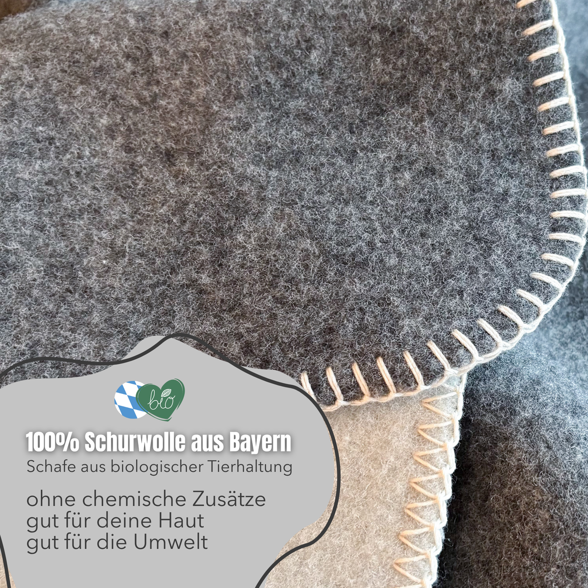 Graue Merino-Wolldecke in 150x210 cm, weiche Kuscheldecke von blanketino.de, zeigt die flauschige Textur und angenehmen Stoff.