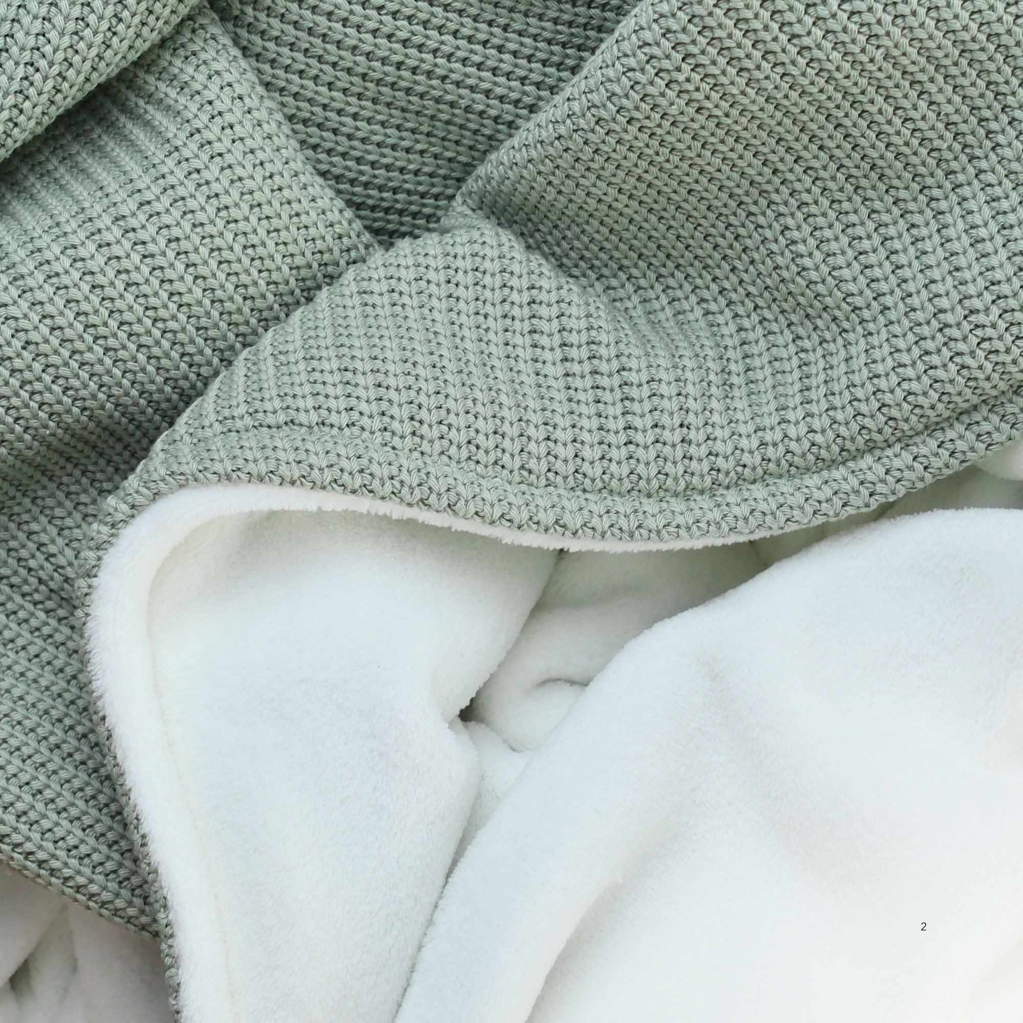 Kuscheldecke mit Baumwollstrick · Pistazie